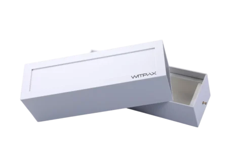 A white rectangular rigid box with a lid partially open, revealing an empty interior. The packaging showcases precise craftsmanship and sturdy construction, ideal for custom box solutions.