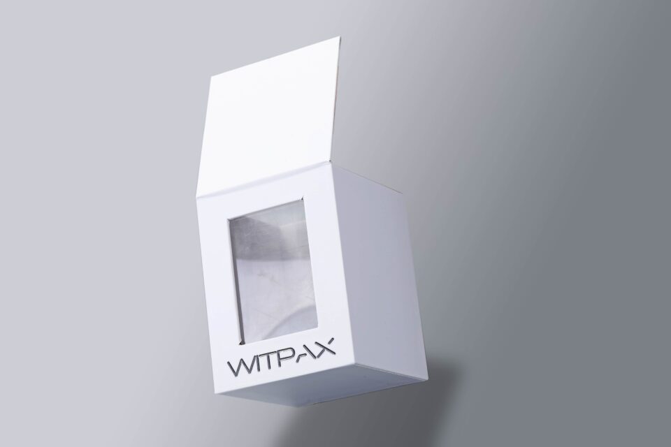 Flip-top box with window