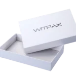 A white rectangular rigid box with the lid slightly ajar, showcasing our custom packaging design. The brand name is prominently featured on the lid.