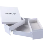 We are a manufacturer of custom box packaging. The image features a white rigid box, partially open to reveal its empty interior, set against a plain background.