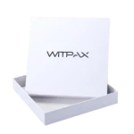 A white rectangular rigid box partially opened with the lid standing upright.