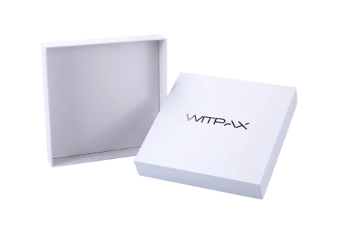 The image depicts a white, rigid, square-shaped box with the lid slightly ajar.