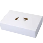 The image features a white rectangular custom packaging box with a triangular cutout, displayed against a plain background.