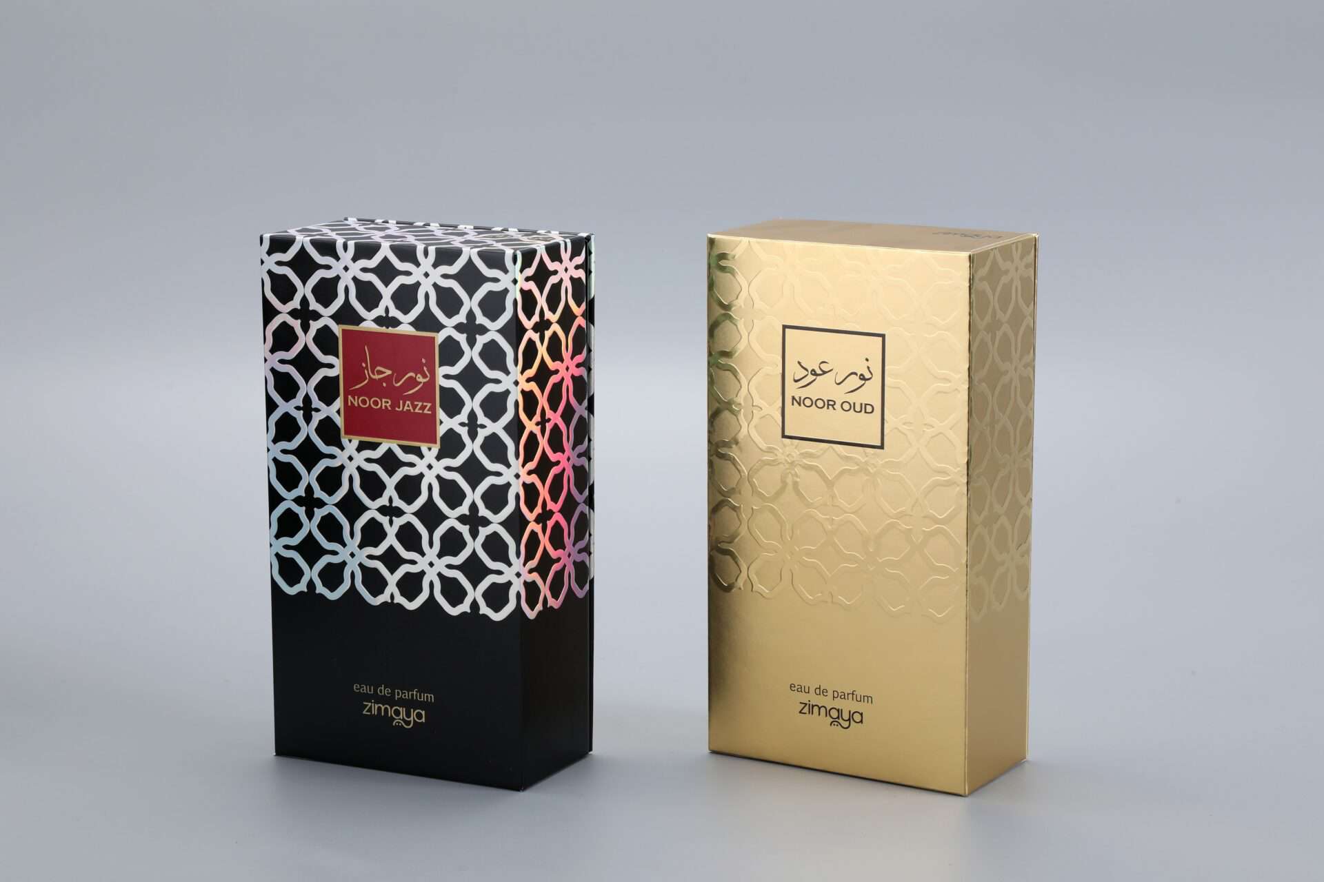 As a manufacturer of custom box packaging, this image showcases two examples of our work. On the left, there is a sophisticated black box featuring a vibrant, eye-catching pattern. On the right, you can see an elegant gold box adorned with a subtle and refined design. Each box exemplifies meticulous craftsmanship and attention to detail, tailored to meet distinct branding needs without displaying specific text on the packaging.