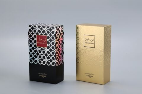 As a manufacturer of custom box packaging, this image showcases two examples of our work. On the left, there is a sophisticated black box featuring a vibrant, eye-catching pattern. On the right, you can see an elegant gold box adorned with a subtle and refined design. Each box exemplifies meticulous craftsmanship and attention to detail, tailored to meet distinct branding needs without displaying specific text on the packaging.