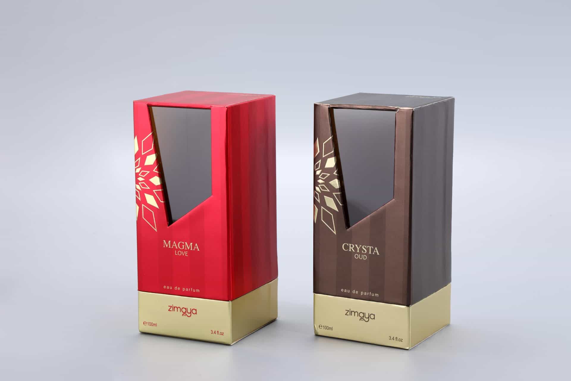 We are a manufacturer of custom box packaging. This image showcases our product line: two distinct perfume boxes set against a neutral gray background. The box on the left features a bold red design, while the box on the right presents an elegant brown hue. Both boxes carry our brand "zimaya" and are labeled as "eau de parfum.