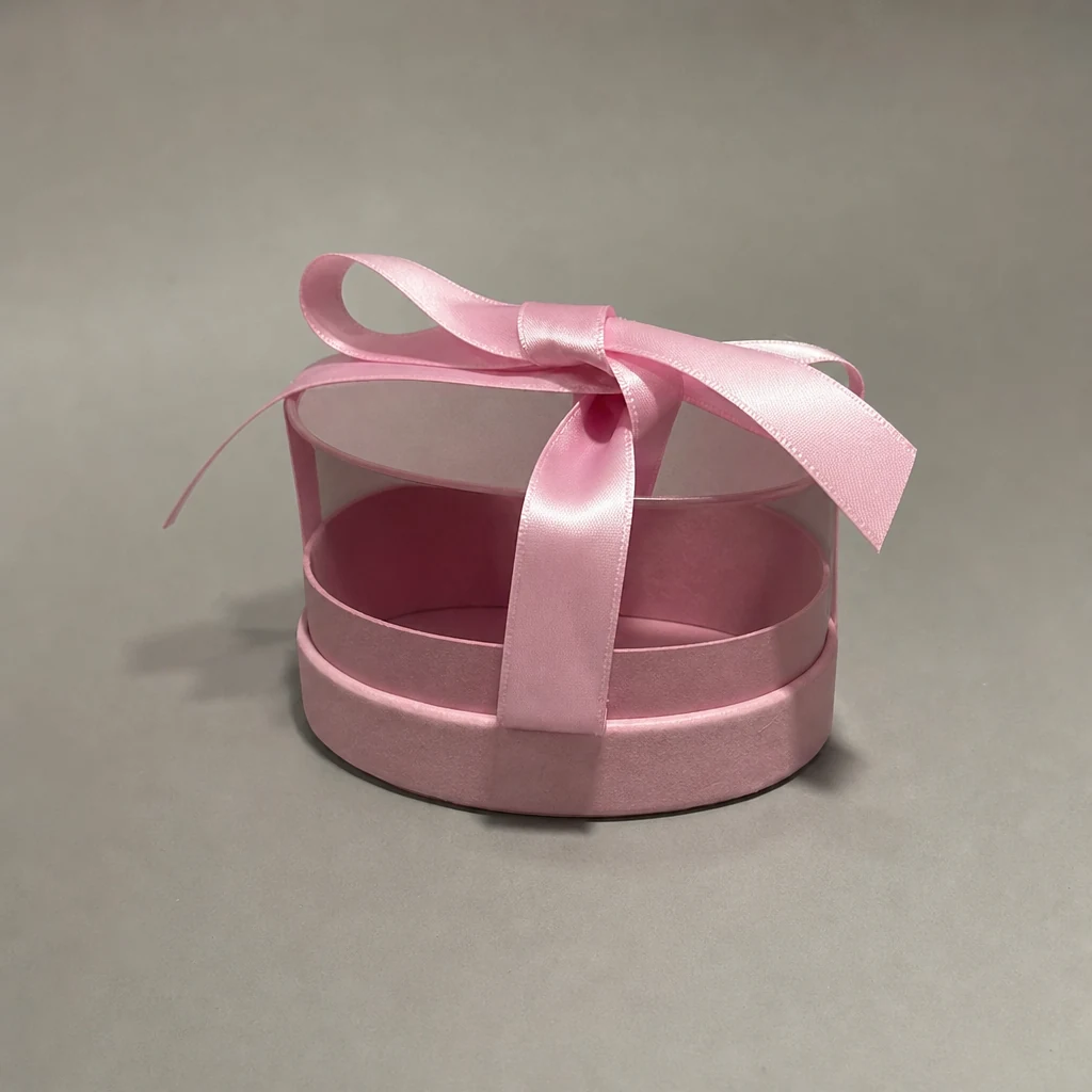 Oval lift-off lid gift box with ribbon packaging box top angle