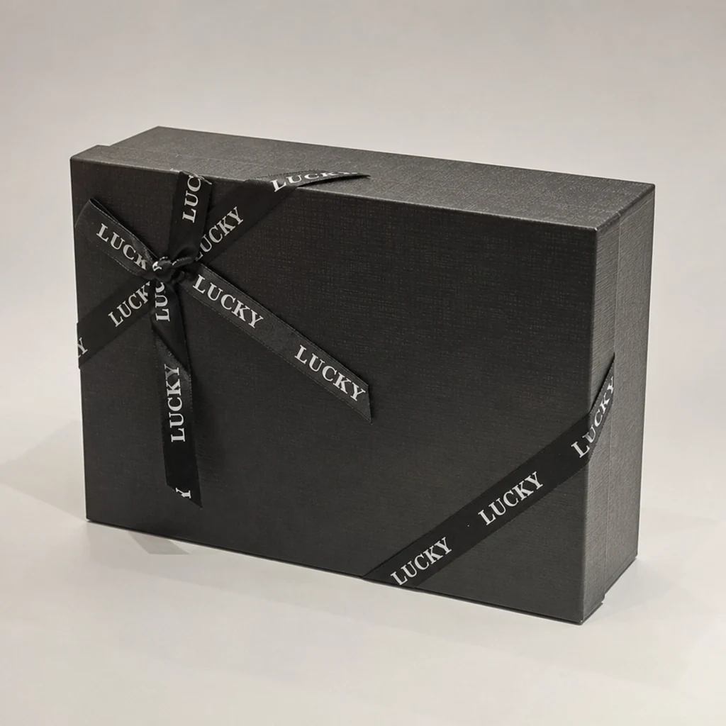 Custom dark lift-off lid box with ribbon packaging box top angle