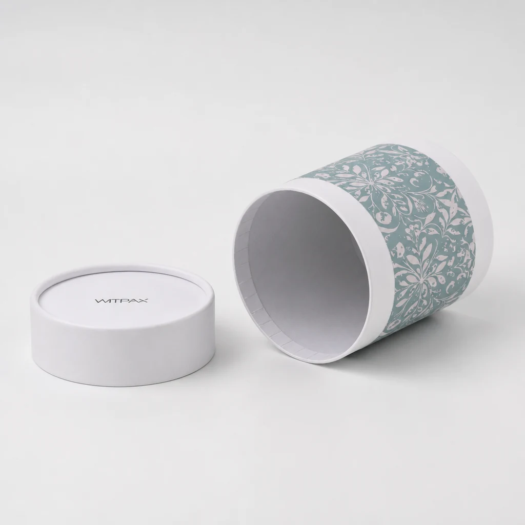 Open round tube box with floral wrap band and detached lid