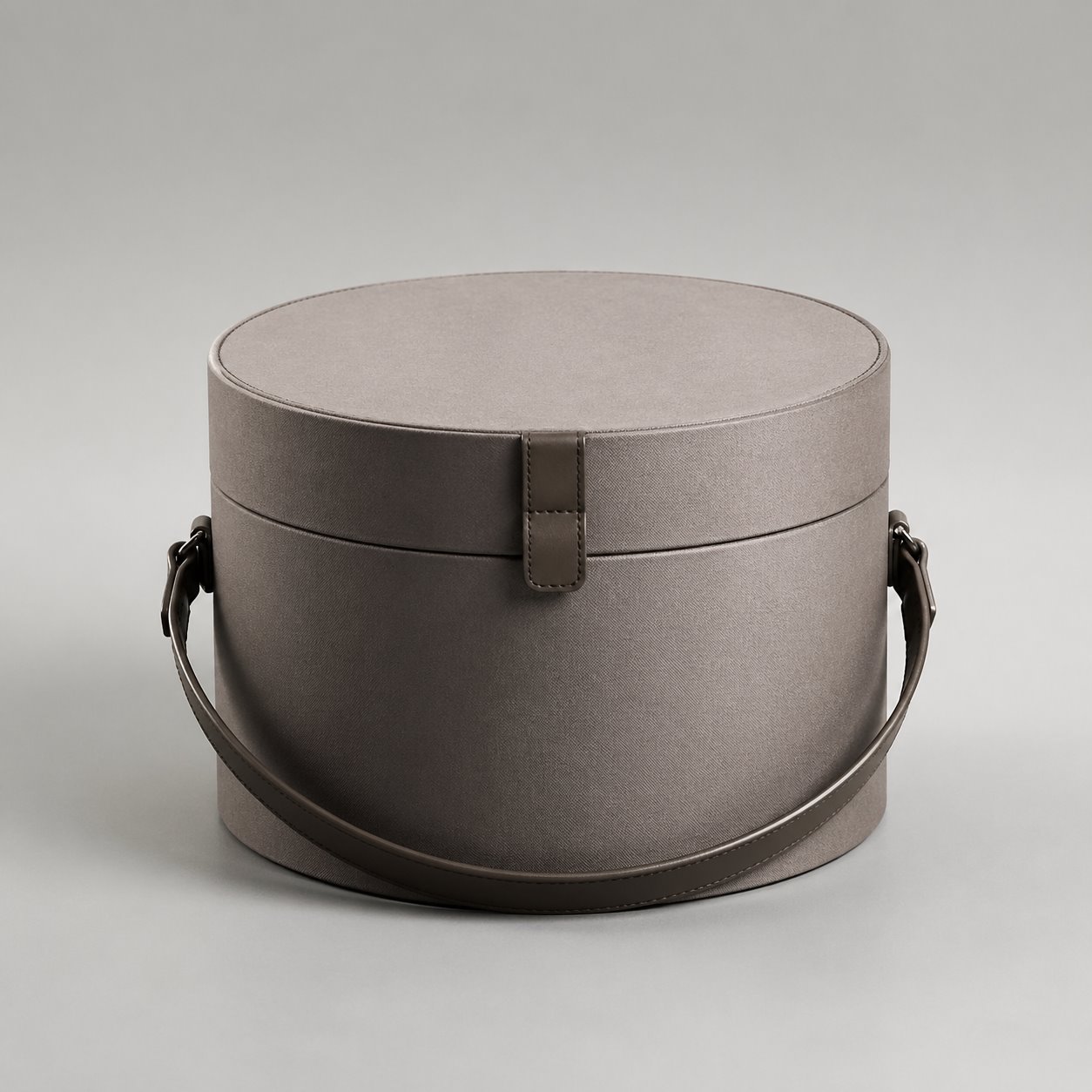 Round shaped lift-off lid box with strap packaging feature image showing Circular Strength: Designed for the Modern Journey