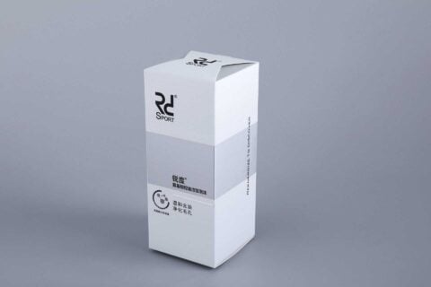 A custom-designed, tall rectangular box with a sleek white finish and branded elements, showcased against a neutral gray backdrop.