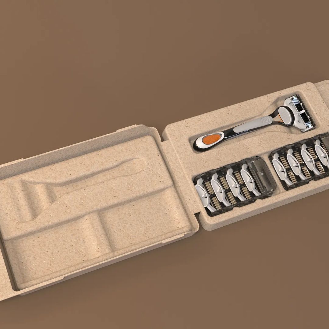 A sleek handle razor kit accompanied by eight refill cartridges is neatly showcased in an open custom corrugated box, all set against a brown background.