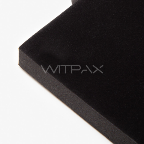 Close-up detail view of black foam box insert showing velvet-textured surface and precision-cut edge