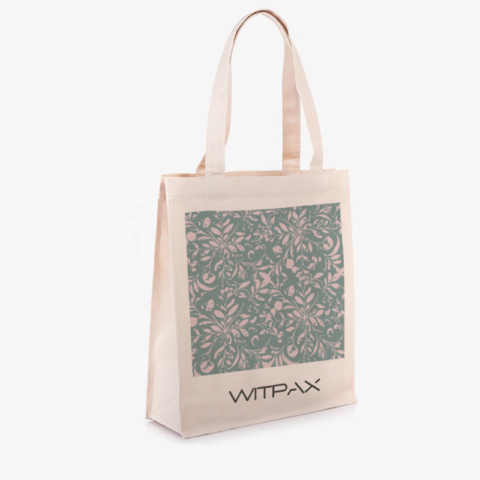 Front view of custom canvas tote bag with green floral pattern and WITPAX logo branding