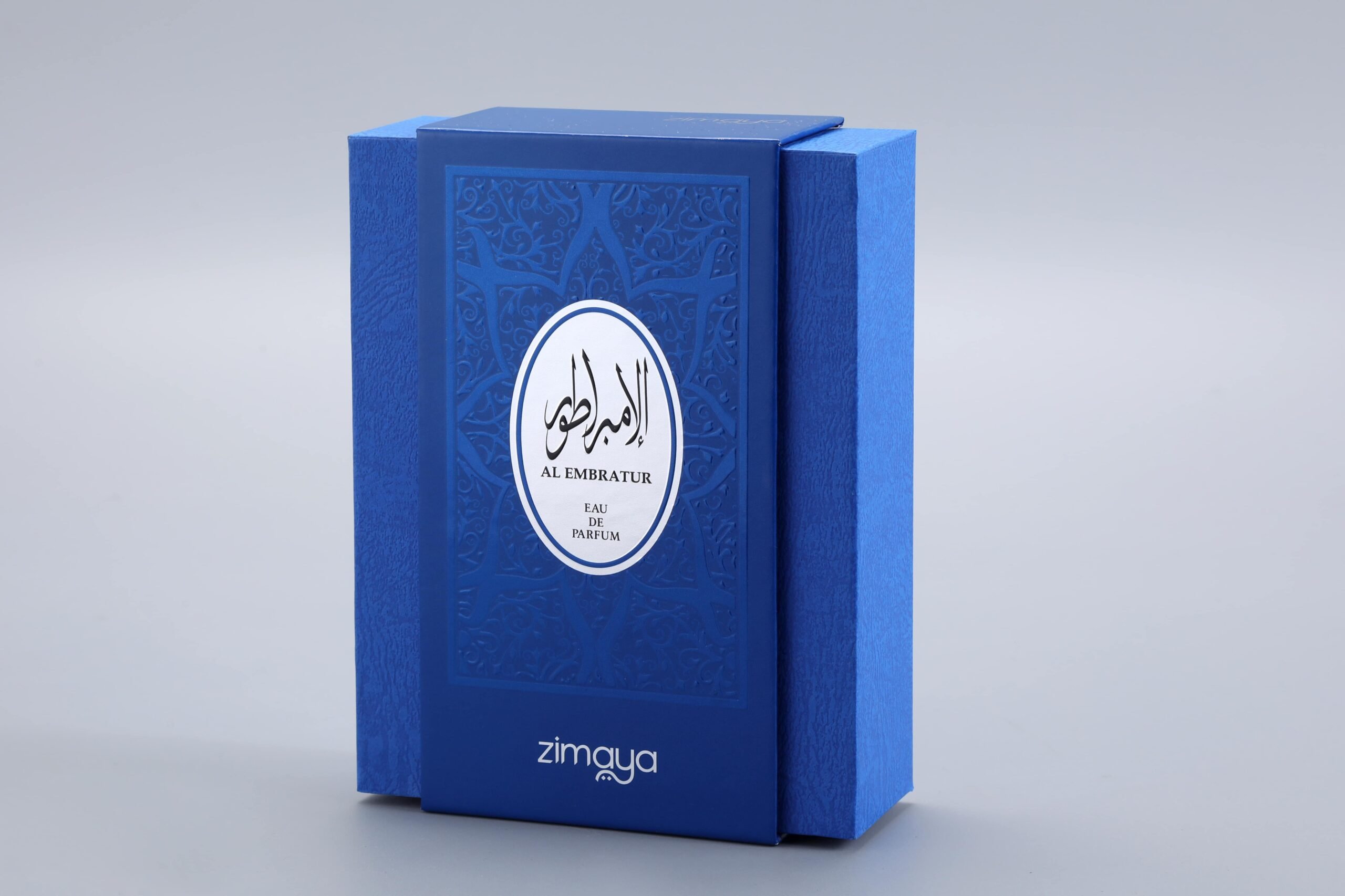 This is a blue custom perfume packaging box featuring intricate decorative patterns. The design incorporates elements suitable for both Arabic and English-speaking markets