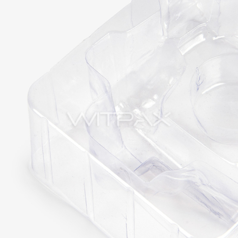 Angled view of clear plastic box insert showing multiple compartments and transparent construction
