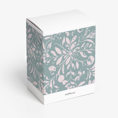 Closed white folding carton with floral pattern sides showing tuck-top closure