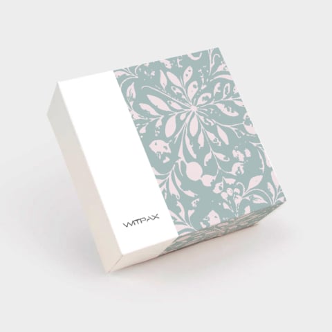 Custom folding carton with sage green floral pattern closed view showing tuck closure and WITPAX branding