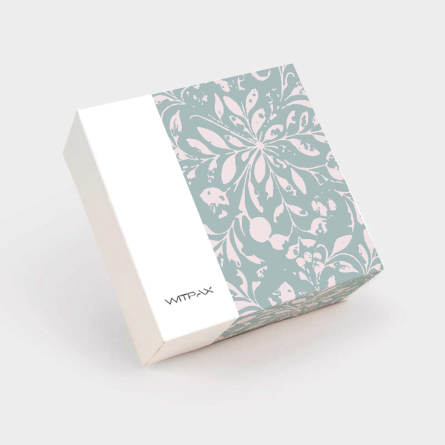 Custom folding carton with sage green floral pattern closed view showing tuck closure and WITPAX branding