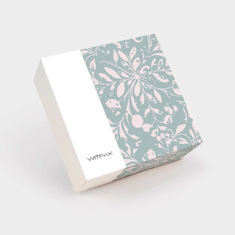 Custom folding carton with sage green floral pattern closed view showing tuck closure and WITPAX branding