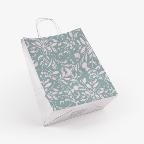 Custom paper shopping bag with sage green floral pattern shown at an angle displaying twisted handles and side gusset