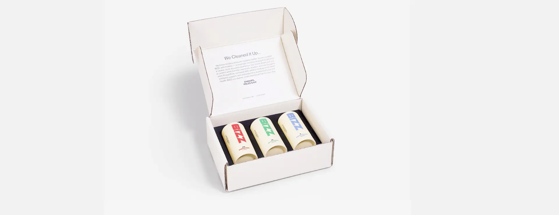 Garrett x WITPAX open box with colored deodorants and a leaflet inside.