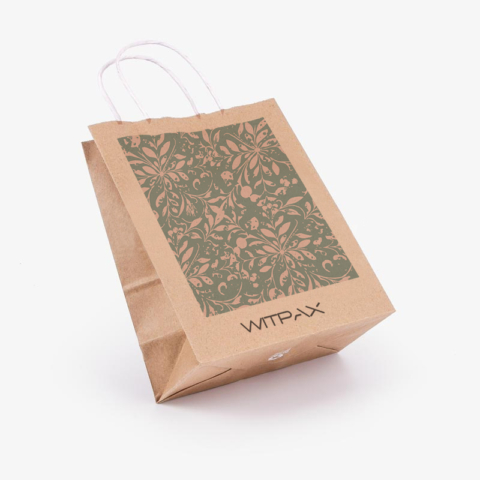 Custom kraft paper shopping bag with green floral print shown at an angle displaying front panel and side gusset