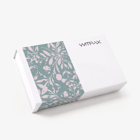 Closed white magnetic rigid box with sage green and pink floral pattern panel and WITPAX branding