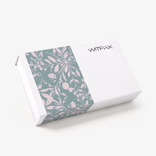 Closed white magnetic rigid box with sage green and pink floral pattern panel and WITPAX branding