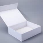 Open white box with a hinged lid and magnetic closure on a gray background.