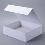 Open white box with a magnetic closure on a gray background.