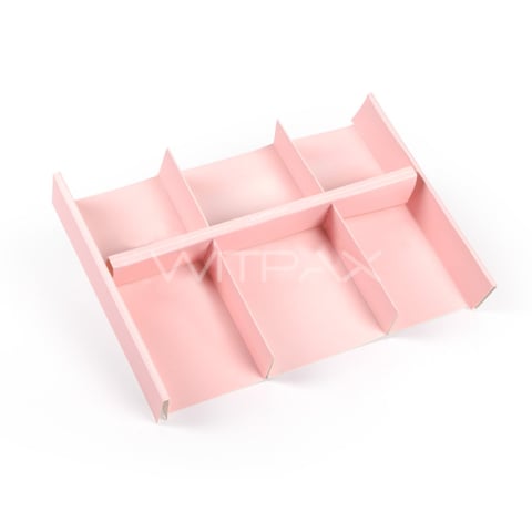Pink cardboard box insert with multiple dividers creating six separate compartments in an organized grid layout