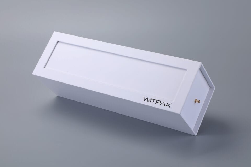 Rectangular box with "WTF-P-X" on one side, featuring a sliding drawer design.