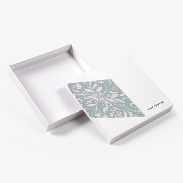 Custom shoulder and neck rigid box shown open with floral pattern panel on lid and white textured finish