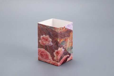 This image showcases a custom rectangular packaging box featuring an elegant floral and landscape design set against a sophisticated gray backdrop.