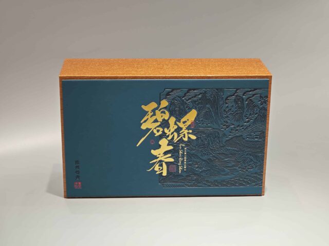 This product is a custom decorative packaging box featuring an elegant design in blue and orange hues, complemented by gold accents on the front.