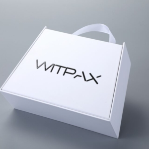 Trapezoidal book-style rigid box with straps