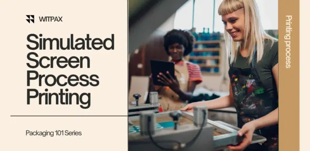 Two women screen printing using advanced techniques, one smiling at the process. simulated screen printing