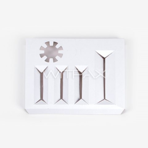 Front view of white die-cut box insert showing geometric compartments and circular cutout