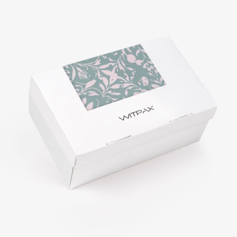 White folding carton with clear window showing floral pattern, closed view with WITPAX branding