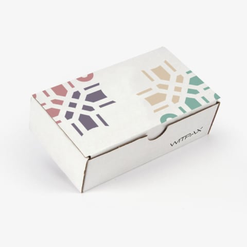 Custom printed mailer box in white with colorful geometric pattern design and brand logo
