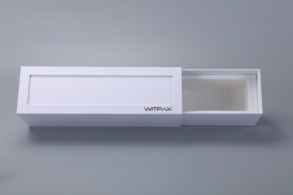 White rectangular sliding drawer with "WTPLX" text, partially open on a gray background.