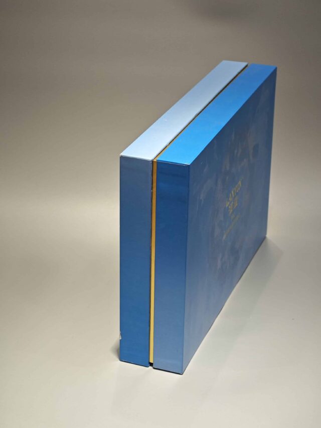 Our product is a custom box featuring intricate floral patterns in blue, designed to encapsulate the elegance and sophistication typical of high-end skincare packaging. The design reflects an attention to detail and premium quality, befitting luxurious cosmetic items.