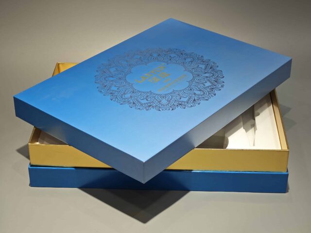 Our product is a custom box featuring intricate floral patterns in blue, designed to encapsulate the elegance and sophistication typical of high-end skincare packaging. The design reflects an attention to detail and premium quality, befitting luxurious cosmetic items.