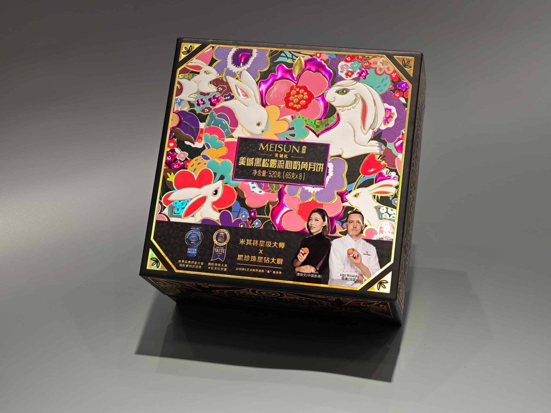 We are a manufacturer of custom box packaging. This image showcases our Colorful Meisuo box, which features an elegant design incorporating rabbits and flowers. The front also includes text in Chinese to enhance its visual appeal, in line with our sophisticated packaging standards.