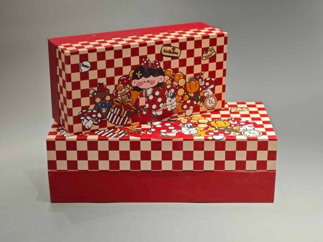 Our product is a custom-designed rectangular gift box in an appealing red color, featuring a checkered lid adorned with playful cartoon characters and food-themed illustrations. This versatile packaging solution is ideal for enhancing any occasion.